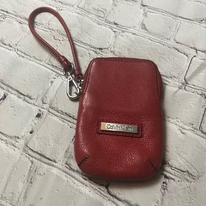 Red Calvin Klein wristlet, smartphone wallet.